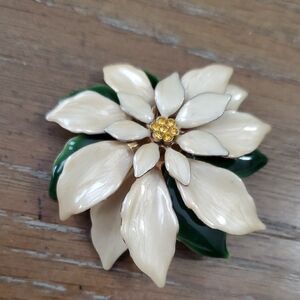 Cream and Green enamel vintage Pointsettia Brooch with amber beading in center